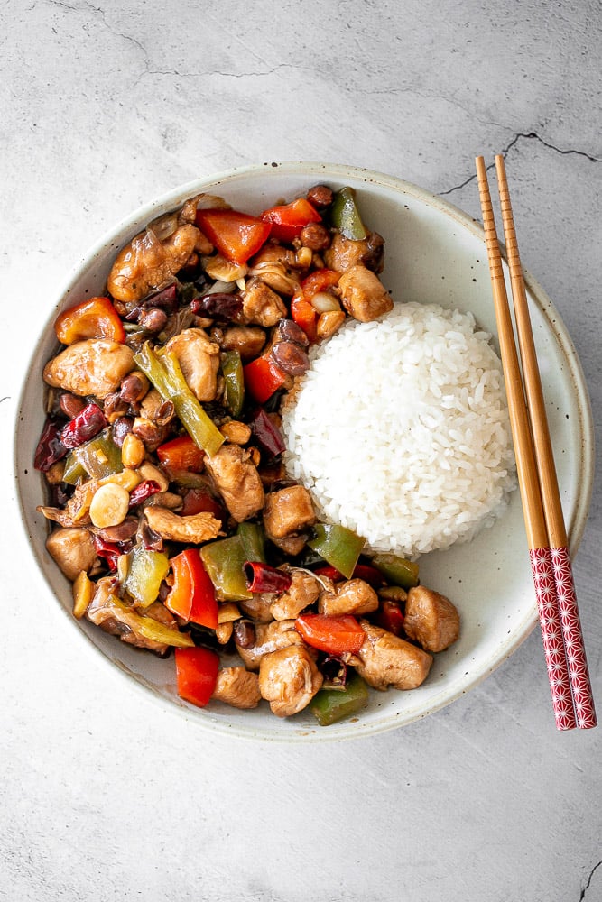 Kung Pao chicken is a Chinese chicken dish that is stir-fried with crisp vegetables and tossed in a delicious Asian sauce packed with flavour. | aheadofthyme.com