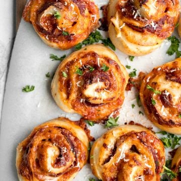 Easy pepperoni pizza rolls are crispy on the bottom, tender and chewy inside, packed with pepperoni and cheese, and baked until bubbly. | aheadofthyme.com