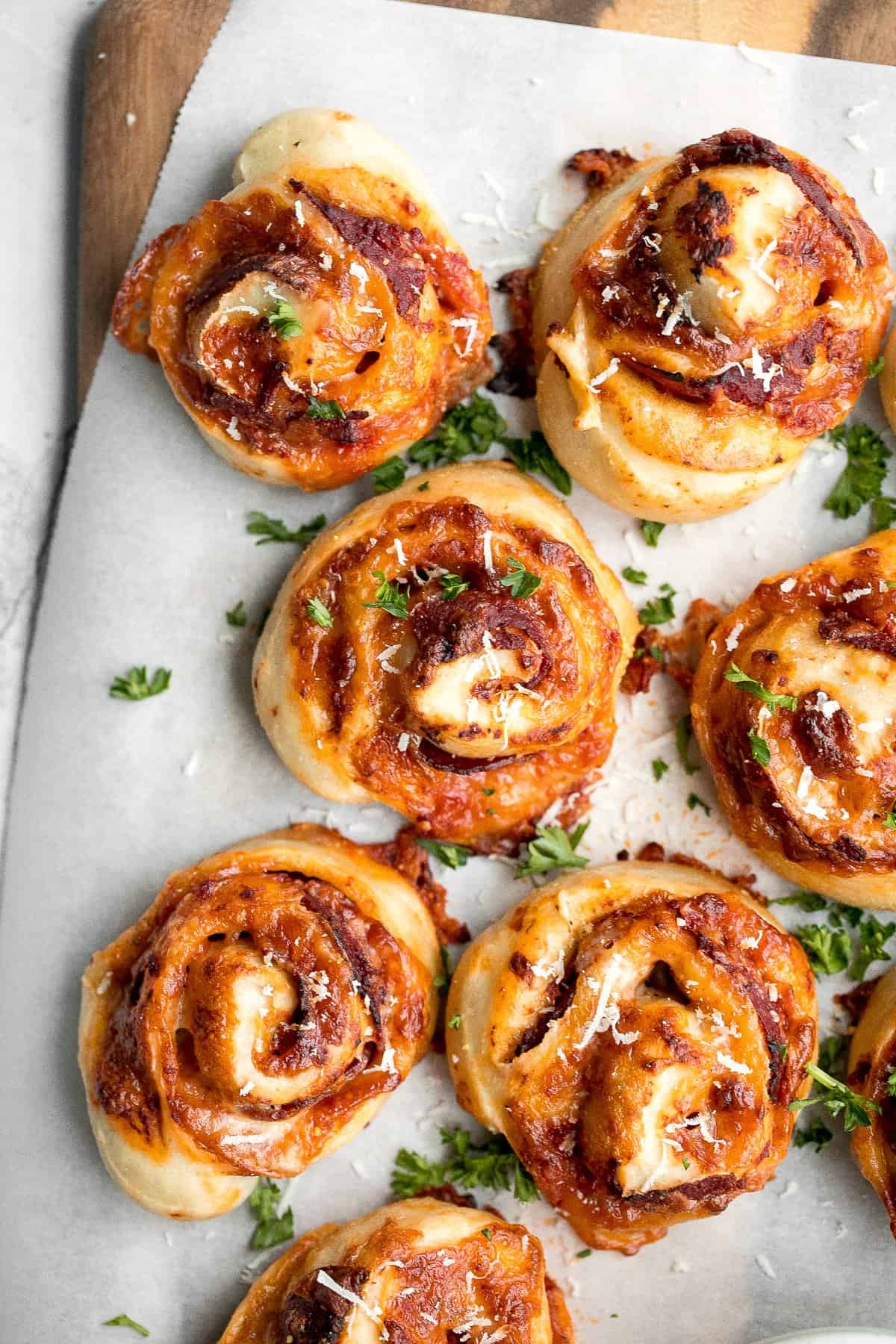 Easy pepperoni pizza rolls are crispy on the bottom, tender and chewy inside, packed with pepperoni and cheese, and baked until bubbly. | aheadofthyme.com