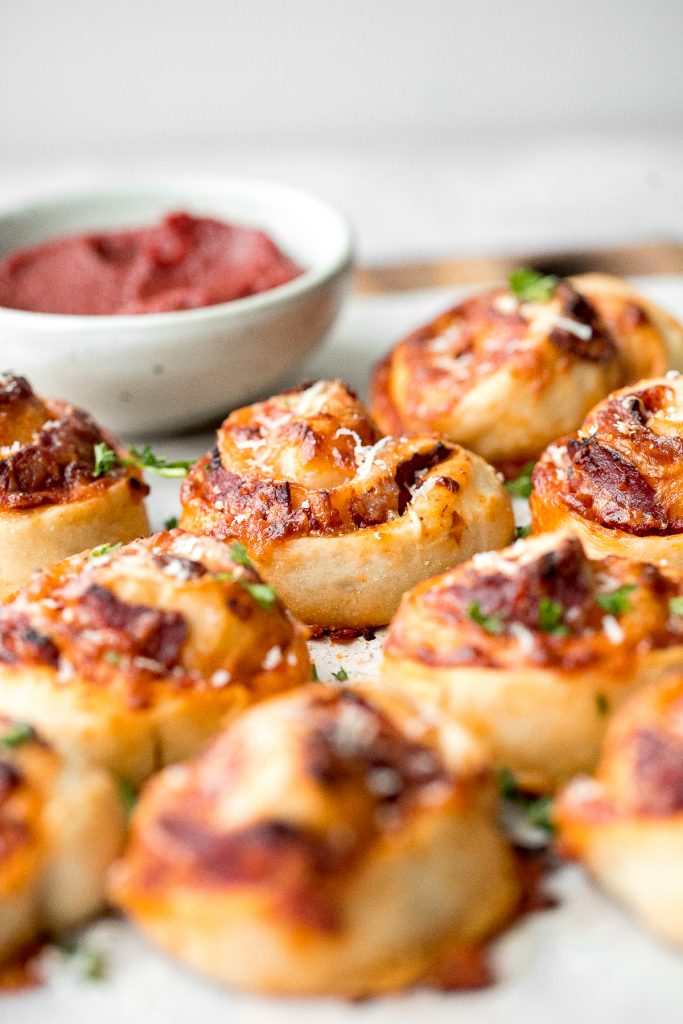 Easy pepperoni pizza rolls are crispy on the bottom, tender and chewy inside, packed with pepperoni and cheese, and baked until bubbly. | aheadofthyme.com