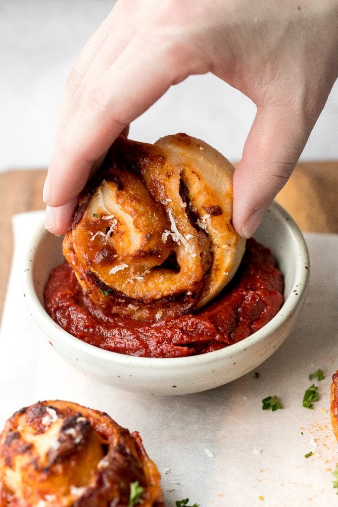 Easy pepperoni pizza rolls are crispy on the bottom, tender and chewy inside, packed with pepperoni and cheese, and baked until bubbly. | aheadofthyme.com