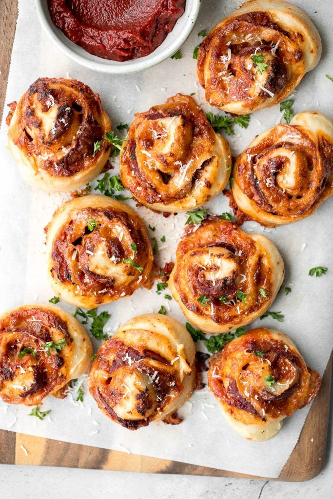 Easy pepperoni pizza rolls are crispy on the bottom, tender and chewy inside, packed with pepperoni and cheese, and baked until bubbly. | aheadofthyme.com