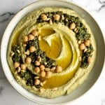Smooth and creamy pesto hummus is a healthy, delicious and flavourful dip that is easy to make in just 5 minutes. It's vegan and gluten-free. | aheadofthyme.com