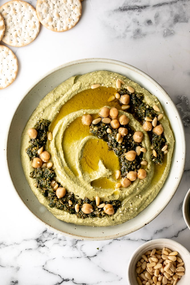 Smooth and creamy pesto hummus is a healthy, delicious and flavourful dip that is easy to make in just 5 minutes. It's vegan and gluten-free. | aheadofthyme.com