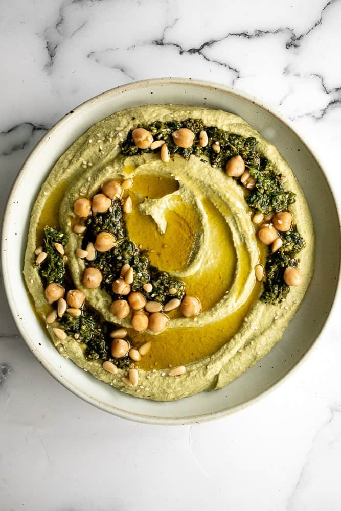 Smooth and creamy pesto hummus is a healthy, delicious and flavourful dip that is easy to make in just 5 minutes. It's vegan and gluten-free. | aheadofthyme.com