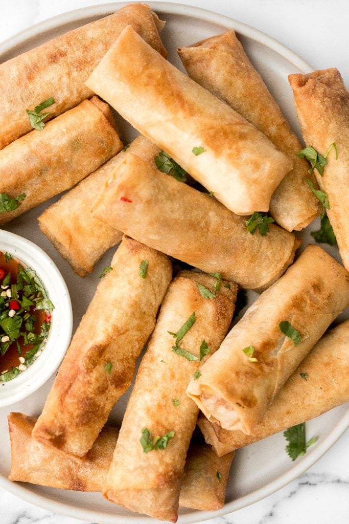 Better than takeout, shrimp egg rolls are a delicious, flavourful and easy appetizer to make. They can be deep fried, baked or air fried. | aheadofthyme.com