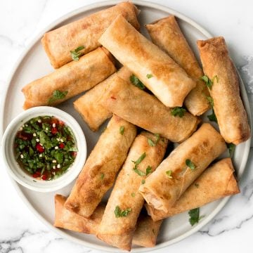 Better than takeout, shrimp egg rolls are a delicious, flavourful and easy appetizer to make. They can be deep fried, baked or air fried. | aheadofthyme.com