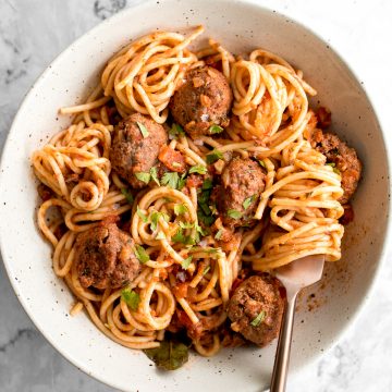 Quick and easy spaghetti and meatballs is delicious, rich, comforting with tender beef meatballs simmered in a savoury tomato sauce. Make it in 30 minutes. | aheadofthyme.com
