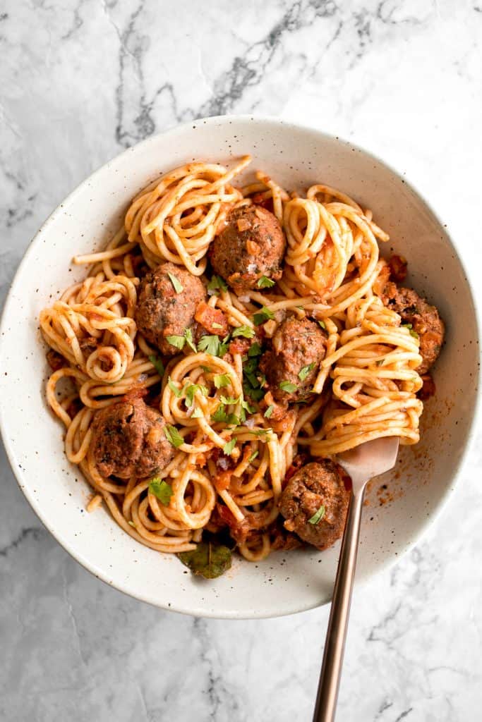 Quick and easy spaghetti and meatballs is delicious, rich, comforting with tender beef meatballs simmered in a savoury tomato sauce. Make it in 30 minutes. | getridtalk.com