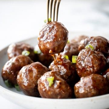 Sticky honey garlic meatballs are a delicious and flavourful 30-minute meal to add to your weekly dinner rotation. A total crowd pleaser. | aheadofthyme.com