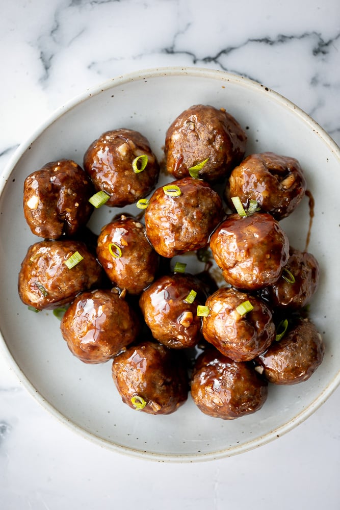 Sticky honey garlic meatballs are a delicious and flavourful 30-minute meal to add to your weekly dinner rotation. A total crowd pleaser. | aheadofthyme.com