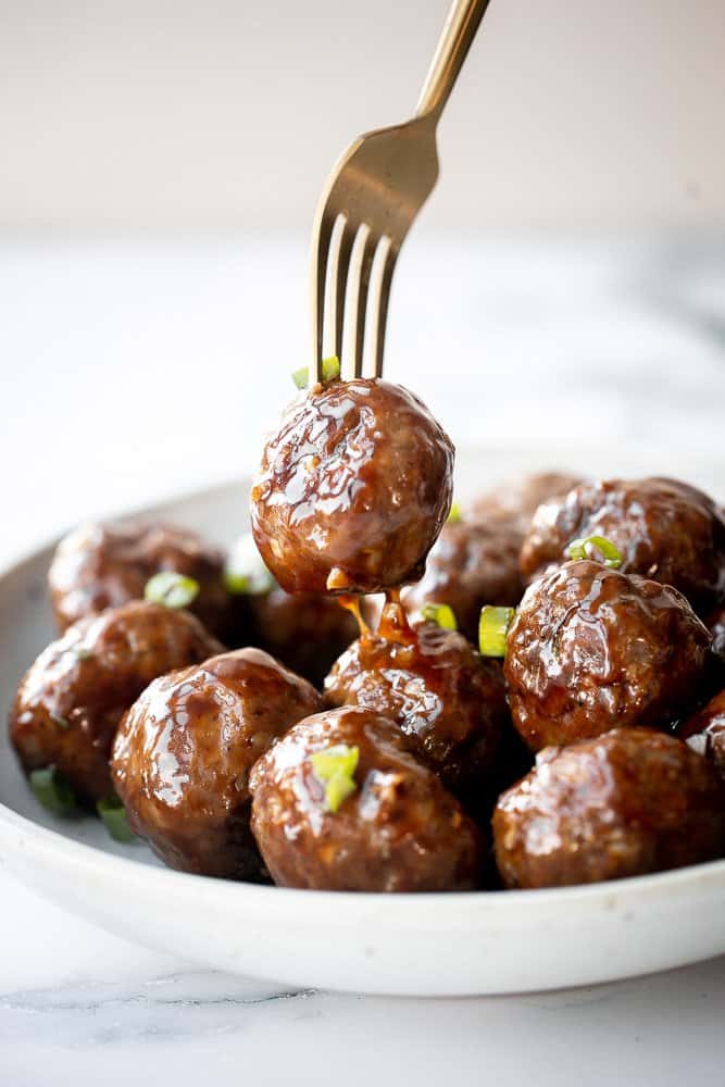 Sticky honey garlic meatballs are a delicious and flavourful 30-minute meal to add to your weekly dinner rotation. A total crowd pleaser. | aheadofthyme.com