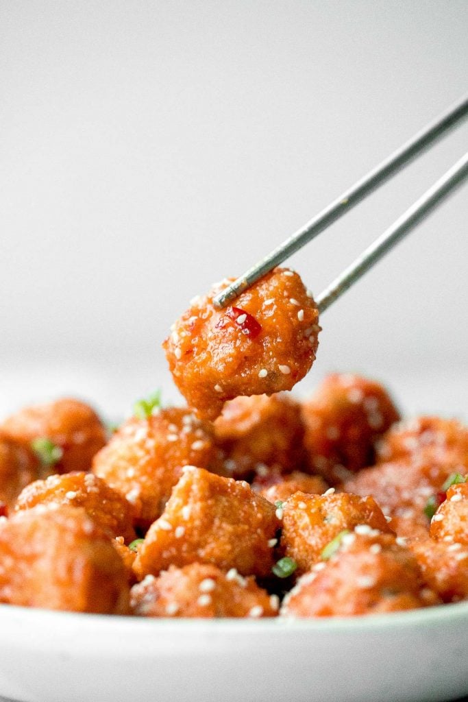 Sticky crispy baked sweet chili chicken bites is better than takeout and so easy to make healthier at home. An easy dinner or game day appy. | aheadofthyme.com