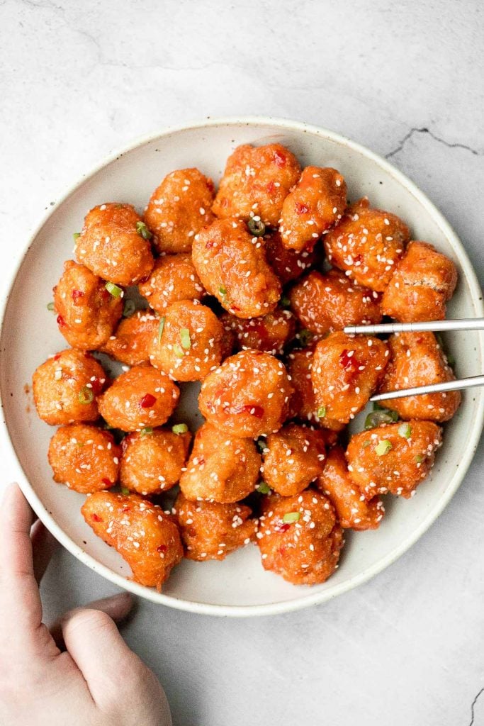 Sticky crispy baked sweet chili chicken bites is better than takeout and so easy to make healthier at home. An easy dinner or game day appy. | aheadofthyme.com