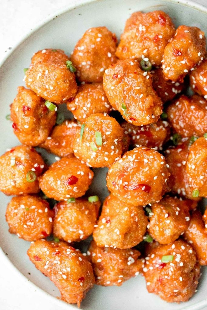 Sticky crispy baked sweet chili chicken bites is better than takeout and so easy to make healthier at home. An easy dinner or game day appy. | aheadofthyme.com