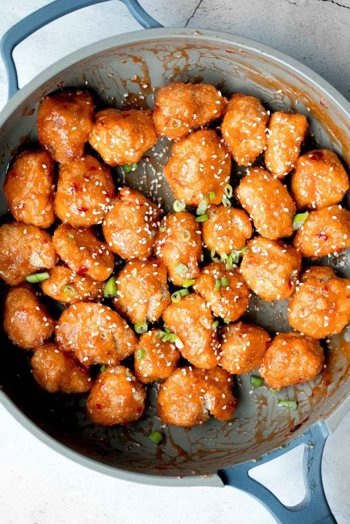 Sticky crispy baked sweet chili chicken bites is better than takeout and so easy to make healthier at home. An easy dinner or game day appy. | aheadofthyme.com