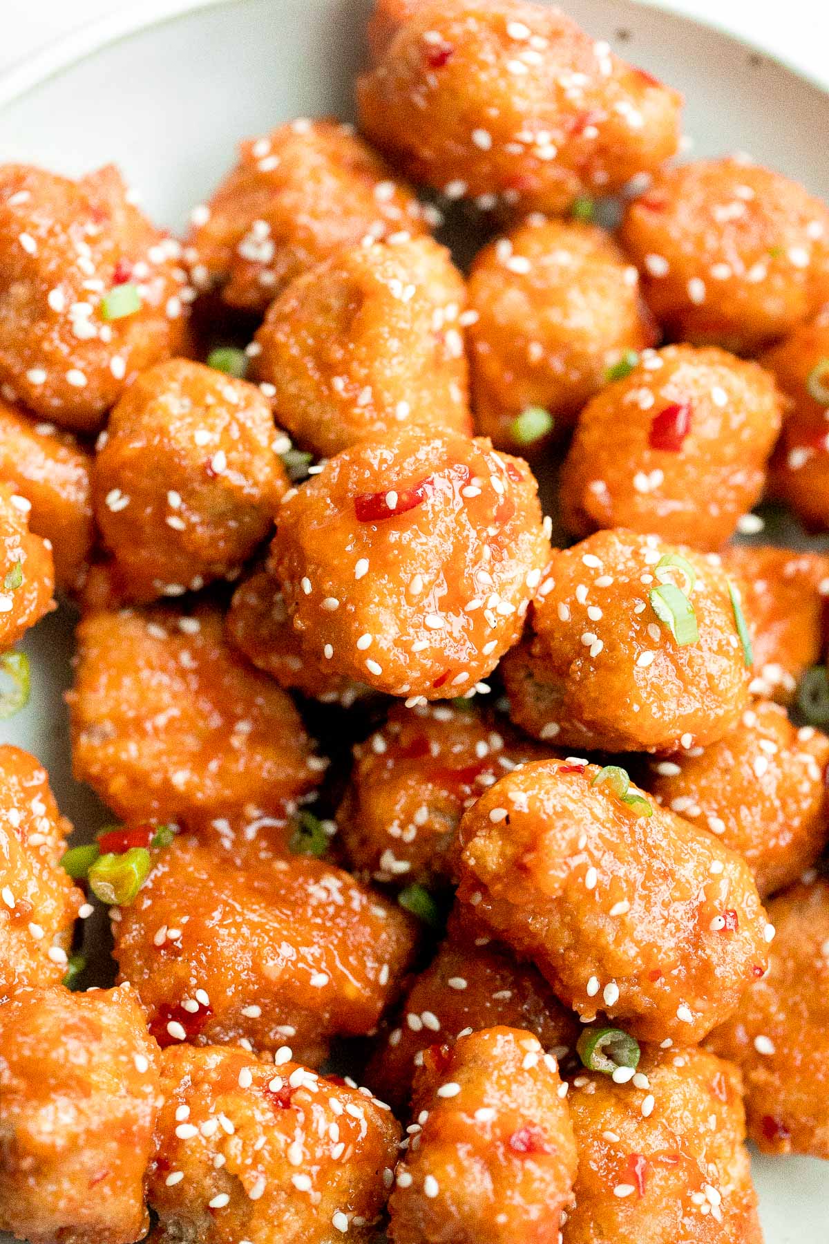 Sticky crispy baked sweet chili chicken bites is better than takeout and so easy to make healthier at home. An easy dinner or game day appy. | aheadofthyme.com