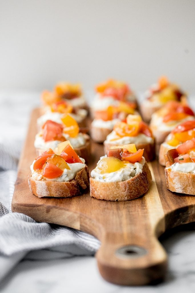 Whipped ricotta crostini is a fancy easy appetizer to make in just minutes or prepare in advance and assemble before serving. A total crowd pleaser. | aheadofthyme.com