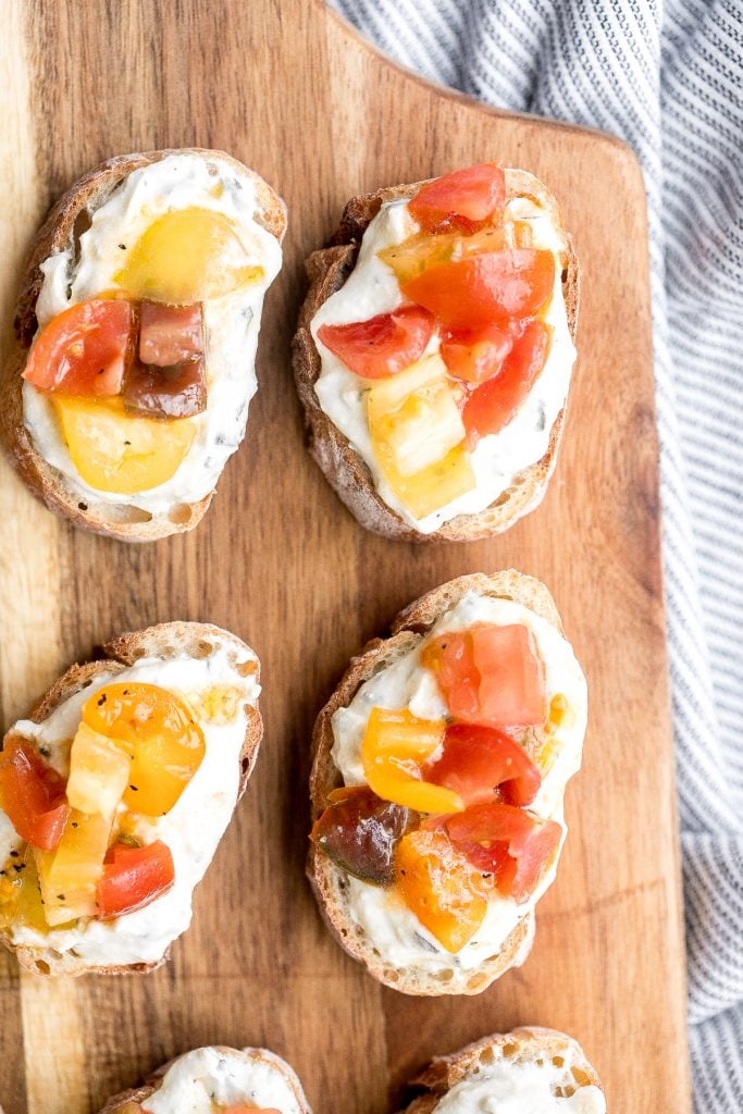 Whipped ricotta crostini is a fancy easy appetizer to make in just minutes or prepare in advance and assemble before serving. A total crowd pleaser. | aheadofthyme.com