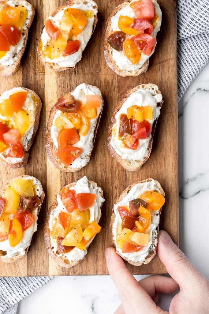 Whipped ricotta crostini is a fancy easy appetizer to make in just minutes or prepare in advance and assemble before serving. A total crowd pleaser. | aheadofthyme.com