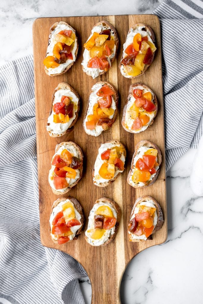 Whipped ricotta crostini is a fancy easy appetizer to make in just minutes or prepare in advance and assemble before serving. A total crowd pleaser. | aheadofthyme.com