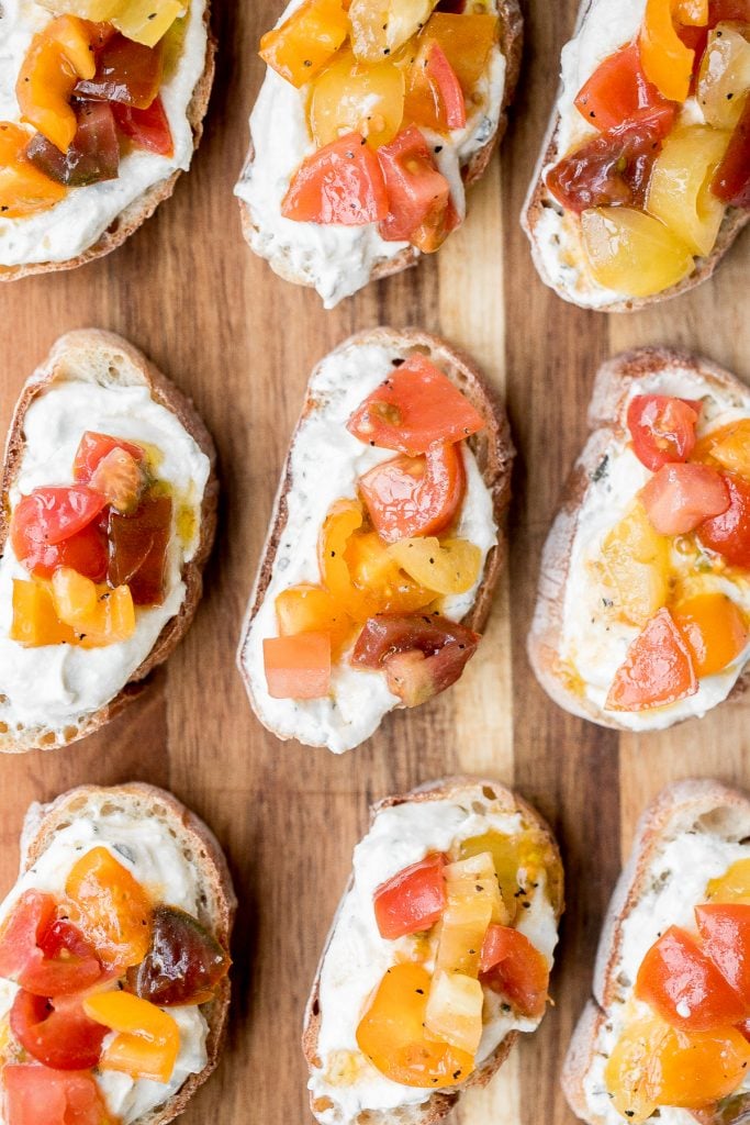 Whipped ricotta crostini is a fancy easy appetizer to make in just minutes or prepare in advance and assemble before serving. A total crowd pleaser. | aheadofthyme.com