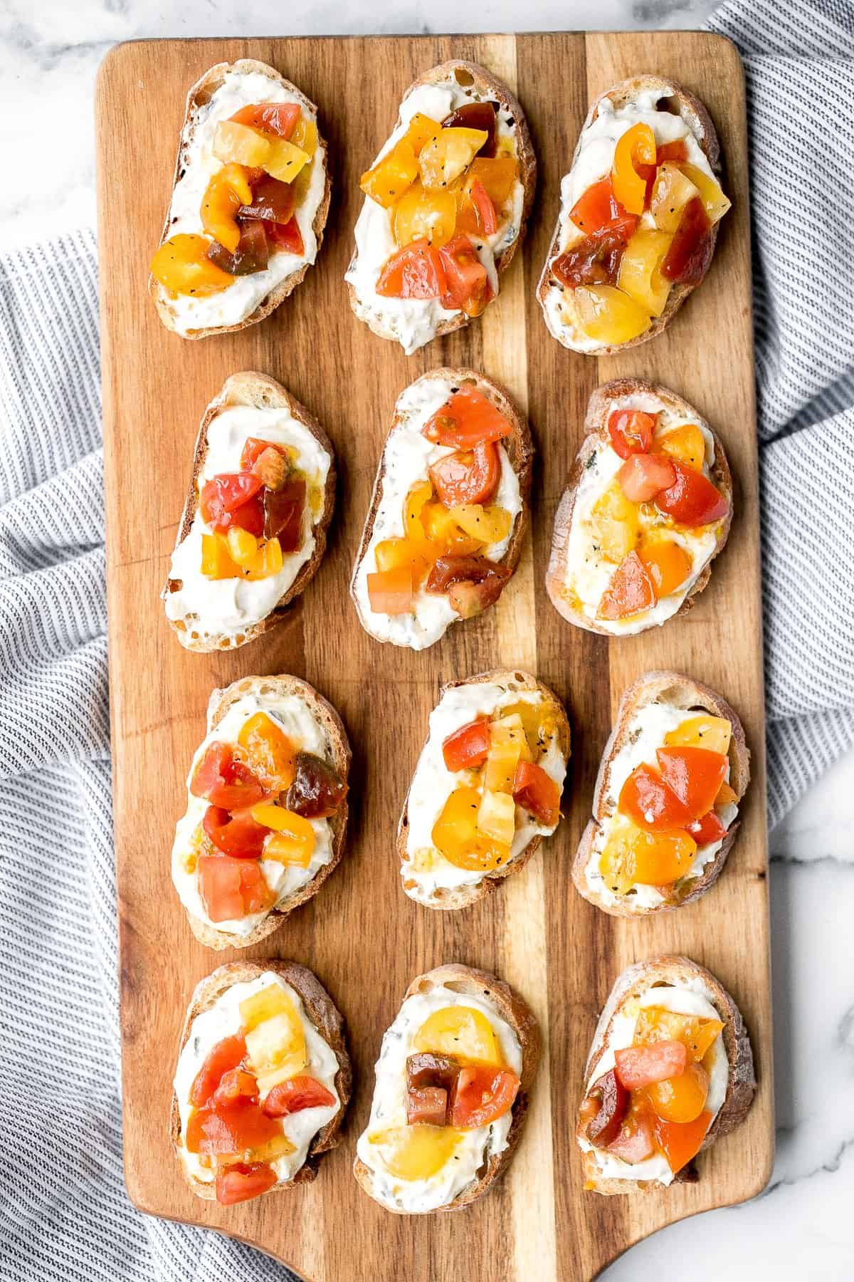 Whipped ricotta crostini is a fancy easy appetizer to make in just minutes or prepare in advance and assemble before serving. A total crowd pleaser. | aheadofthyme.com