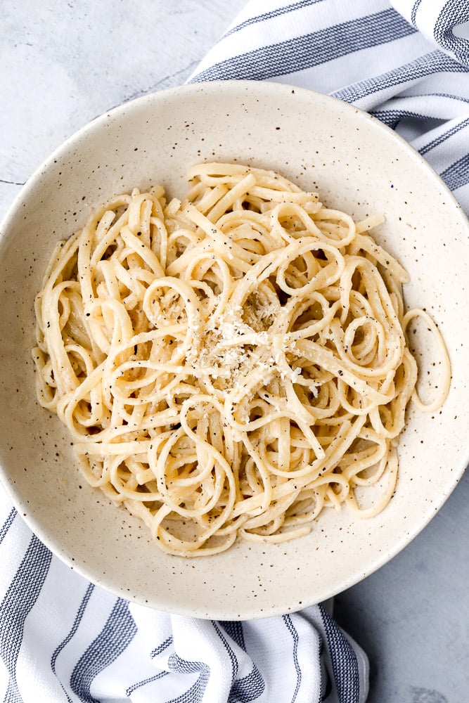 Cacio e pepe is a simple, authentic Italian pasta dish made with just four ingredients in 20 minutes. It's delicious, flavourful and easy to make. | aheadofthyme.com