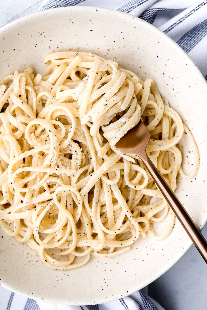 Cacio e pepe is a simple, authentic Italian pasta dish made with just four ingredients in 20 minutes. It's delicious, flavourful and easy to make. | aheadofthyme.com