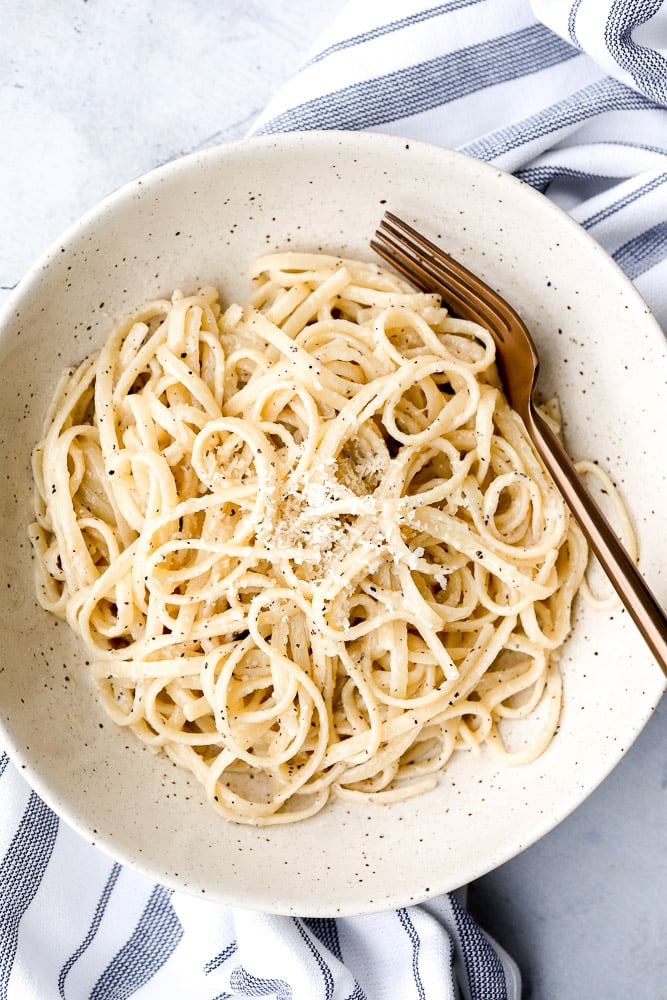 Cacio e pepe is a simple, authentic Italian pasta dish made with just four ingredients in 20 minutes. It's delicious, flavourful and easy to make. | aheadofthyme.com