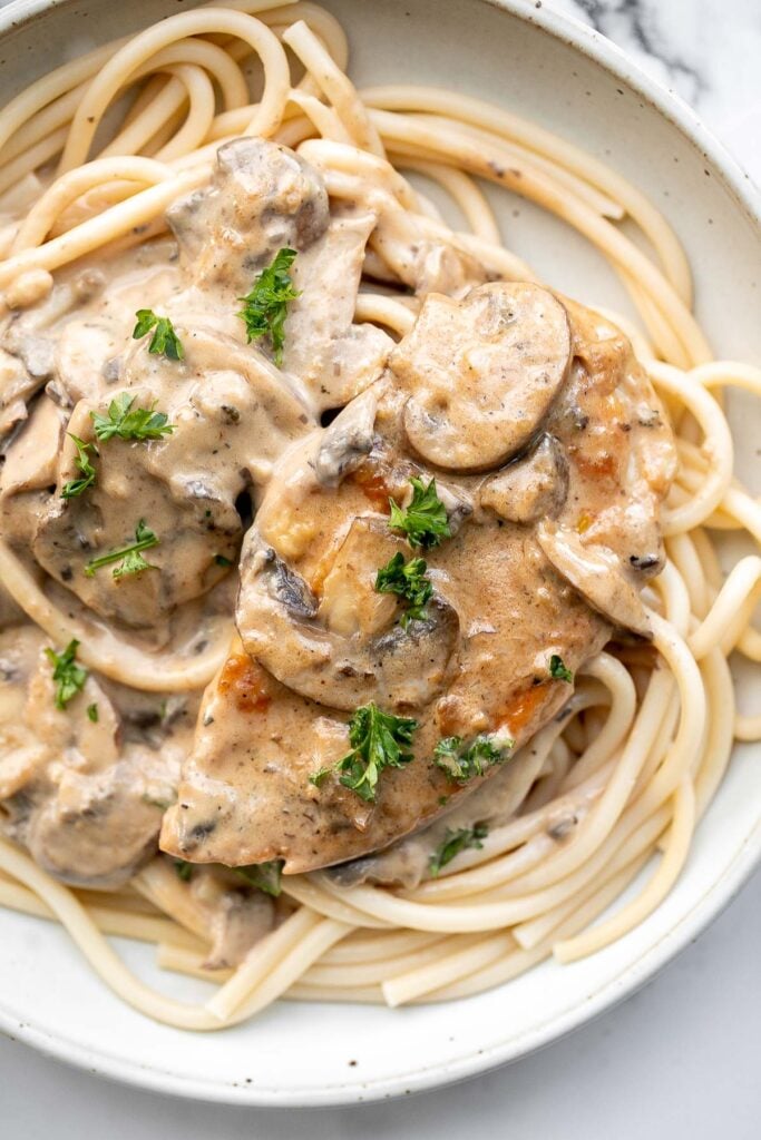 Chicken marsala in creamy mushroom sauce is a quick and easy 30-minute chicken dinner that is pure comfort food goals. A total crowd favourite. | aheadofthyme.com