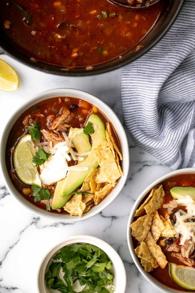 Hearty chicken tortilla soup is a delicious, wholesome and filling soup that you can make in about 30 minutes, packed with classic Mexican flavours. | aheadofthyme.com