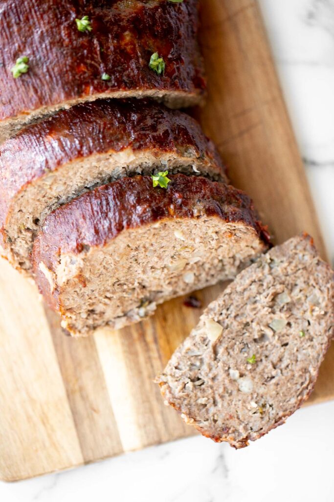 This hearty classic meatloaf with a caramelized glaze will nourish your body and soul. Feed the whole family with a simple yet flavourful classic. | aheadofthyme.com