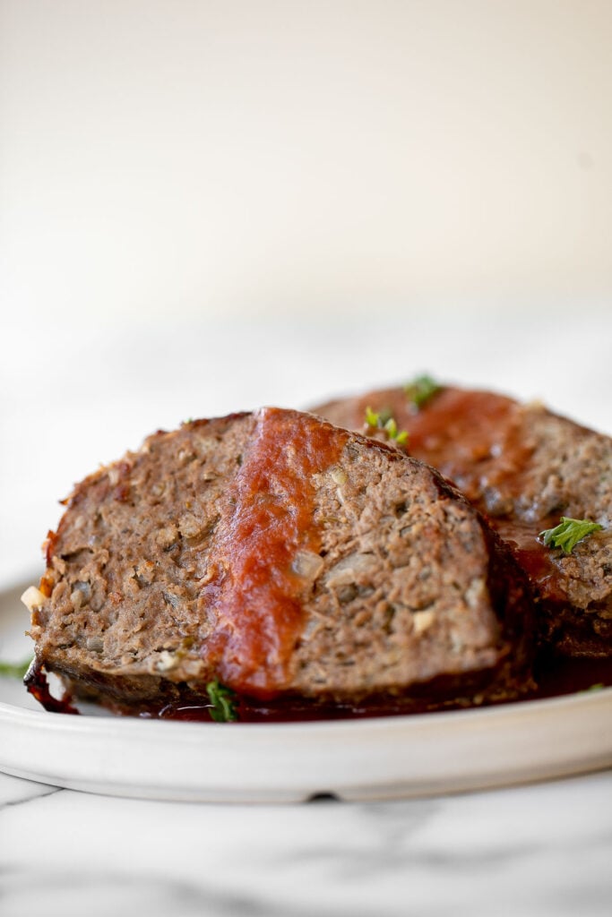 This hearty classic meatloaf with a caramelized glaze will nourish your body and soul. Feed the whole family with a simple yet flavourful classic. | aheadofthyme.com