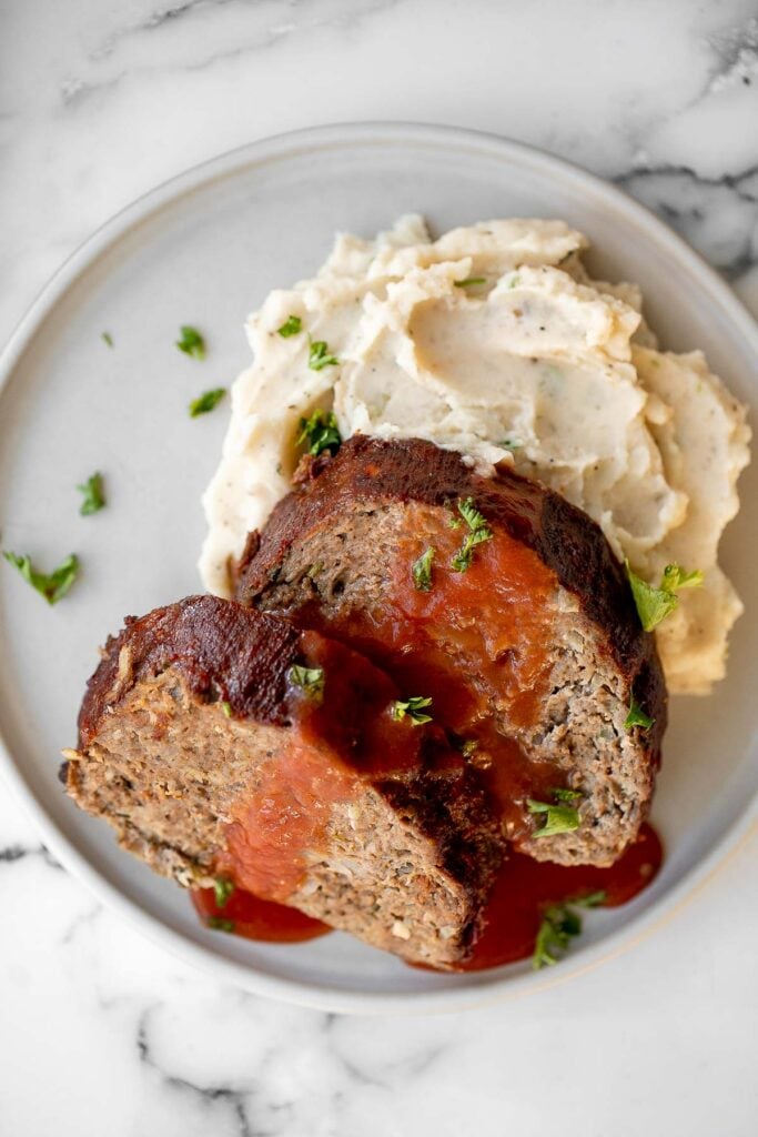 This hearty classic meatloaf with a caramelized glaze will nourish your body and soul. Feed the whole family with a simple yet flavourful classic. | aheadofthyme.com