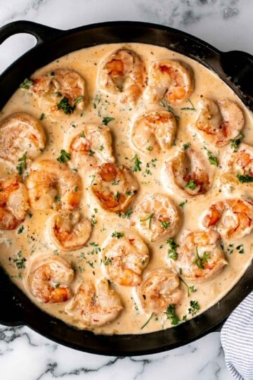 Creamy Garlic Shrimp is a quick and easy 15-minute meal made with juicy shrimp in a cheesy garlic cream sauce. Perfect for weeknight dinners! | aheadofthyme.com