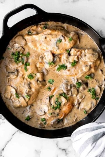 Easy Chicken Marsala is creamy, savory, and comforting. Juicy chicken in a silky, creamy mushroom marsala wine sauce ready in 30 minutes! | aheadofthyme.com