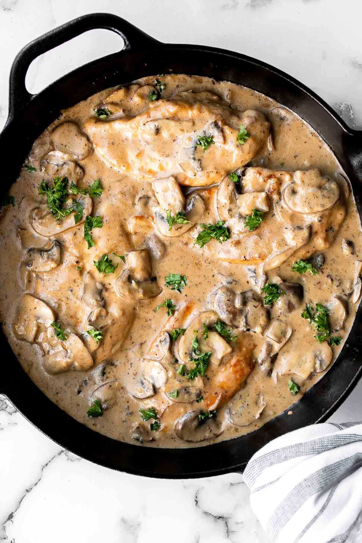 Easy Chicken Marsala is creamy, savory, and comforting. Juicy chicken in a silky, creamy mushroom marsala wine sauce ready in 30 minutes! | aheadofthyme.com