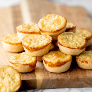 Mini egg tarts with a flaky buttery crust and silky smooth rich egg custard filling are a delicious Hong Kong pastry served as dessert with dim sum. | aheadofthyme.com