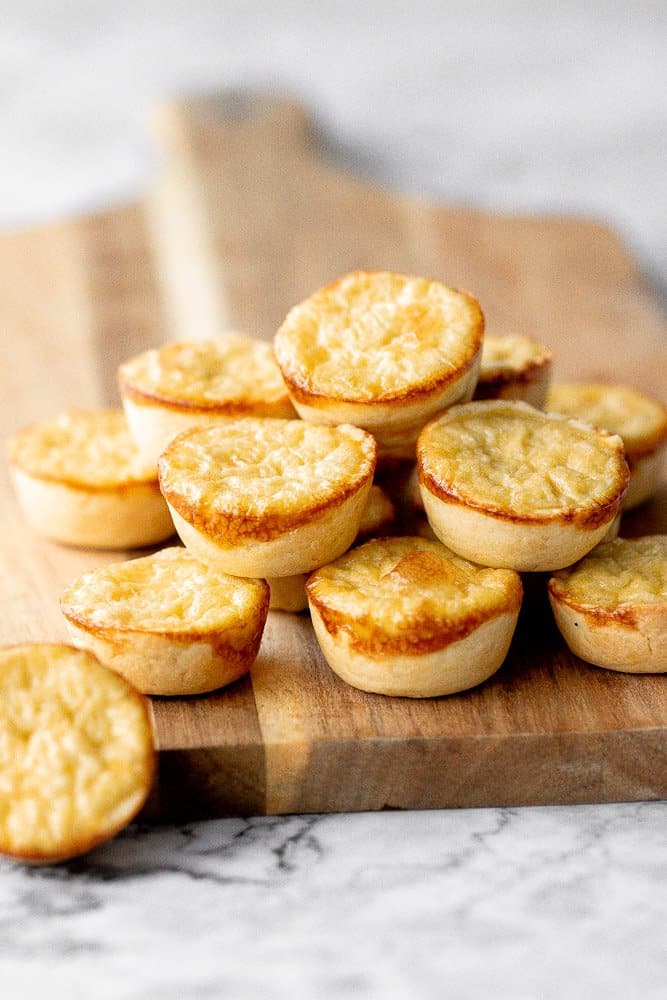 Mini egg tarts with a flaky buttery crust and silky smooth rich egg custard filling are a delicious Hong Kong pastry served as dessert with dim sum. | aheadofthyme.com