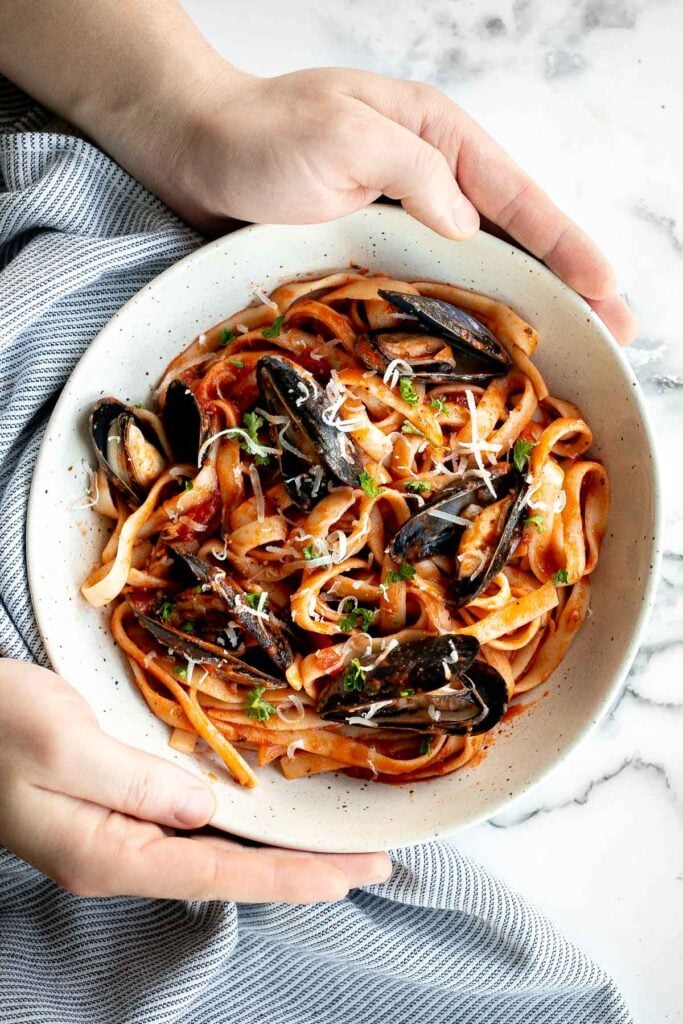 Mussels pasta in tomato sauce is a simple, light and fresh, seafood pasta dinner that you can make at home in 30 minutes. Easiest weeknight dinner. | aheadofthyme.com