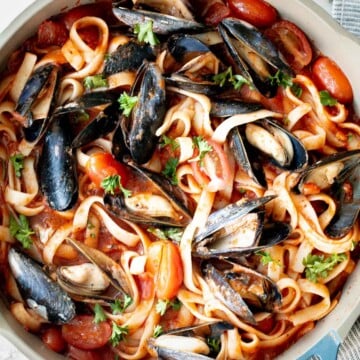 Mussels pasta in tomato sauce is a simple, light and fresh, seafood pasta dinner that you can make at home in 30 minutes. Easiest weeknight dinner. | aheadofthyme.com