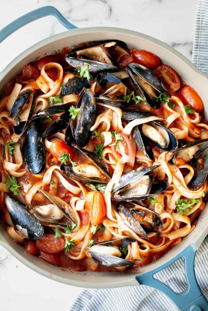 Mussels pasta in tomato sauce is a simple, light and fresh, seafood pasta dinner that you can make at home in 30 minutes. Easiest weeknight dinner. | aheadofthyme.com