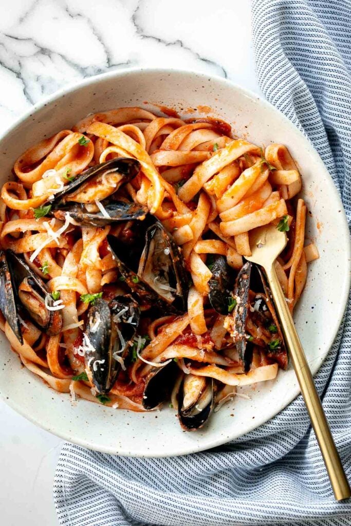 Mussels pasta in tomato sauce is a simple, light and fresh, seafood pasta dinner that you can make at home in 30 minutes. Easiest weeknight dinner. | aheadofthyme.com