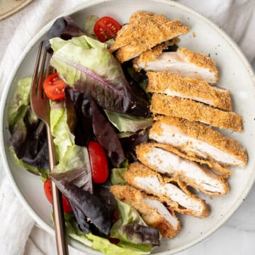 Baked parmesan crusted chicken is breaded in a herby parmesan breadcrumb mixture and baked until crispy perfection. So flavourful and delicious. | aheadofthyme.com