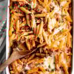 Pasta bake with sausage (baked ziti) is a lazy day lasagna with layers of pasta tossed in a rich meat sauce, layered with mozzarella, and baked. | aheadofthyme.com