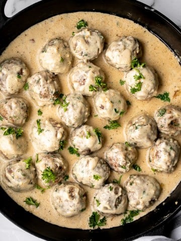 Delicious, comforting homemade Swedish meatballs are seared and smothered in a creamy gravy sauce and taste so much better than IKEA meatballs. | aheadofthyme.com