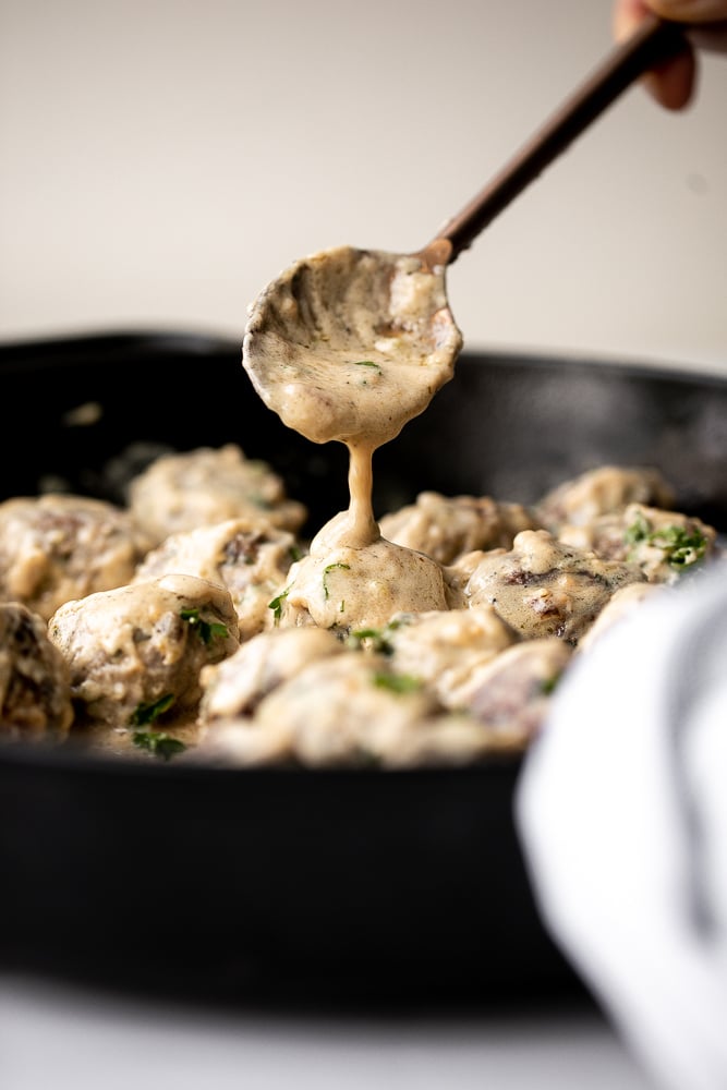 Delicious, comforting homemade Swedish meatballs are seared and smothered in a creamy gravy sauce and taste so much better than IKEA meatballs. | aheadofthyme.com