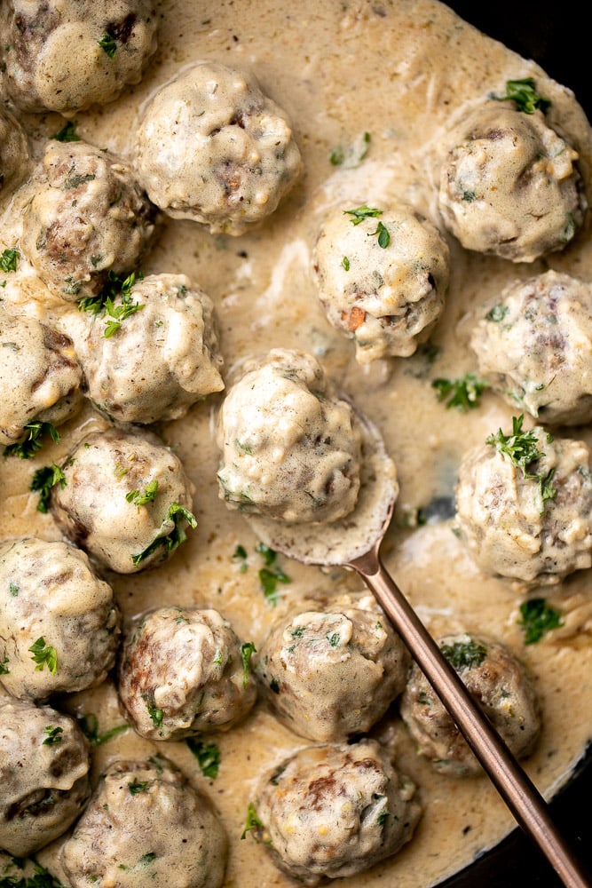 Delicious, comforting homemade Swedish meatballs are seared and smothered in a creamy gravy sauce and taste so much better than IKEA meatballs. | aheadofthyme.com