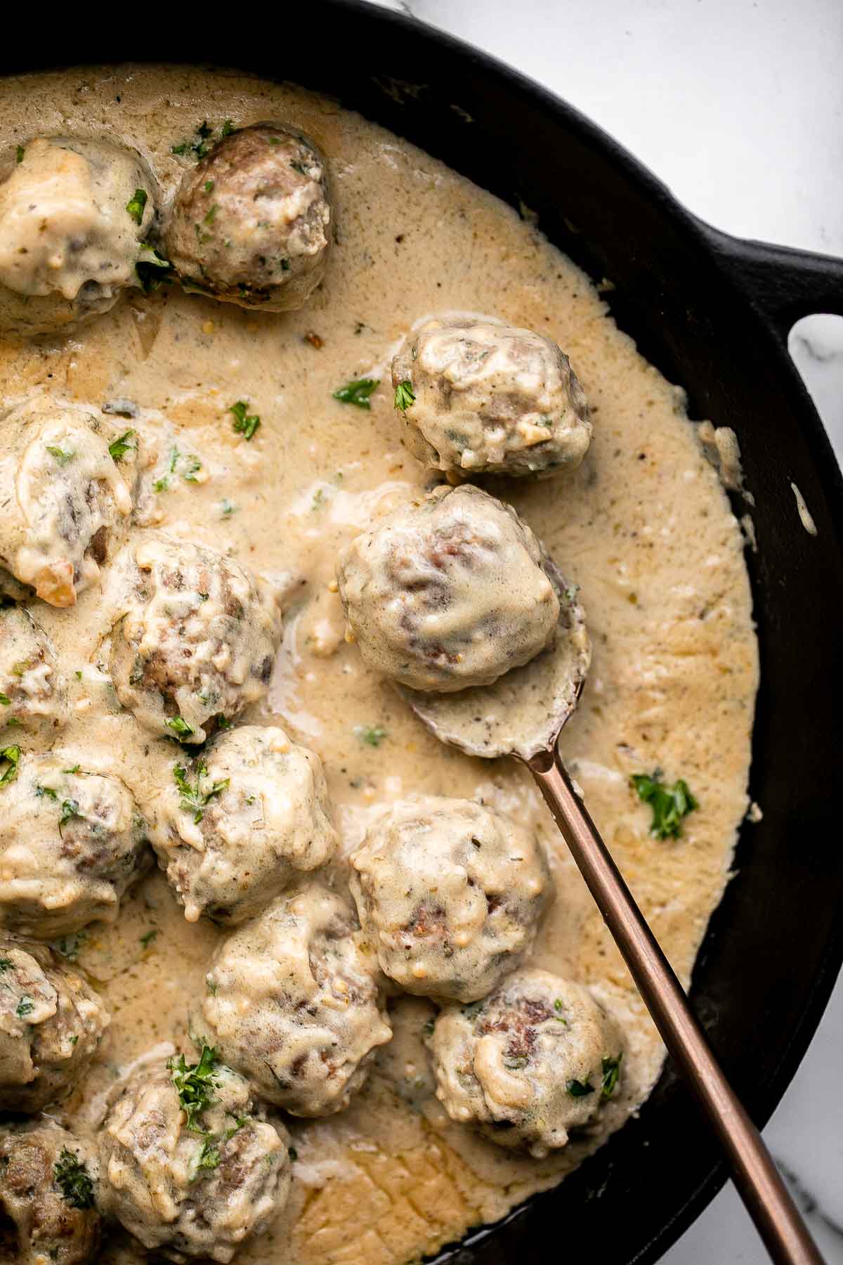 Homemade Swedish Meatballs are seared and smothered in creamy gravy. Comforting, delicious, and so much better than IKEA meatballs. | aheadofthyme.com